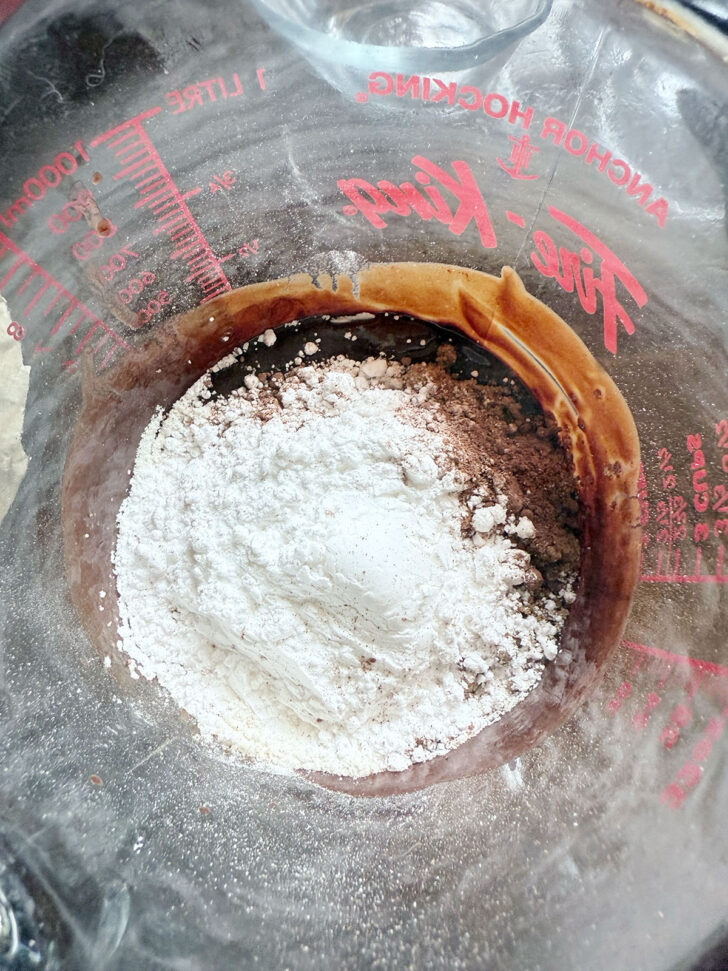 Adding flour to the melted chocolate and butter.