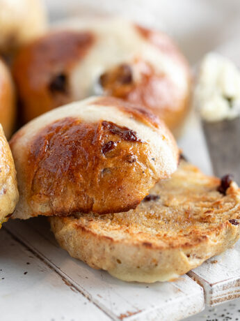 Earl Grey hot cross buns on a serving board.