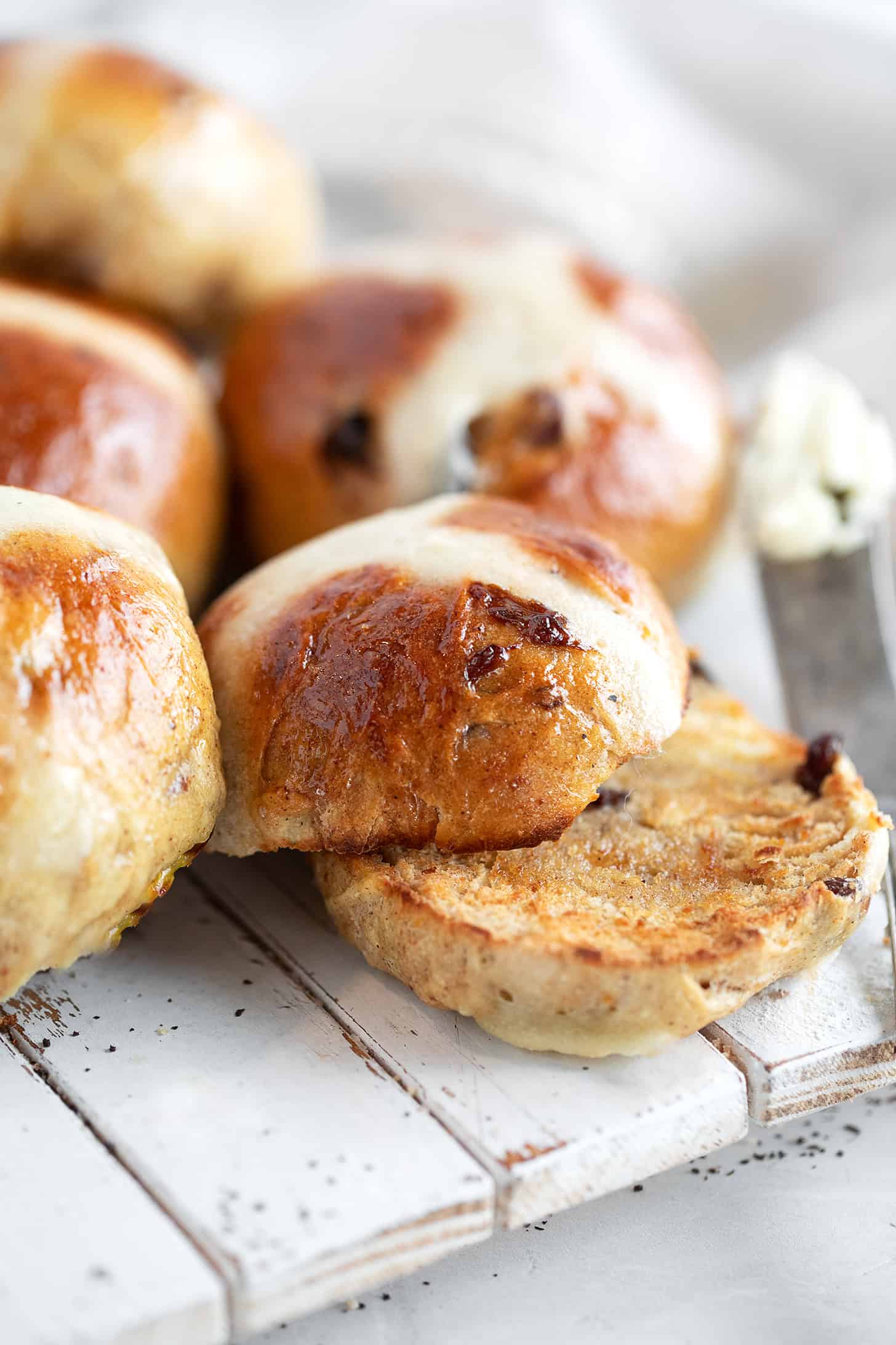 Earl Grey hot cross buns on a serving board.
