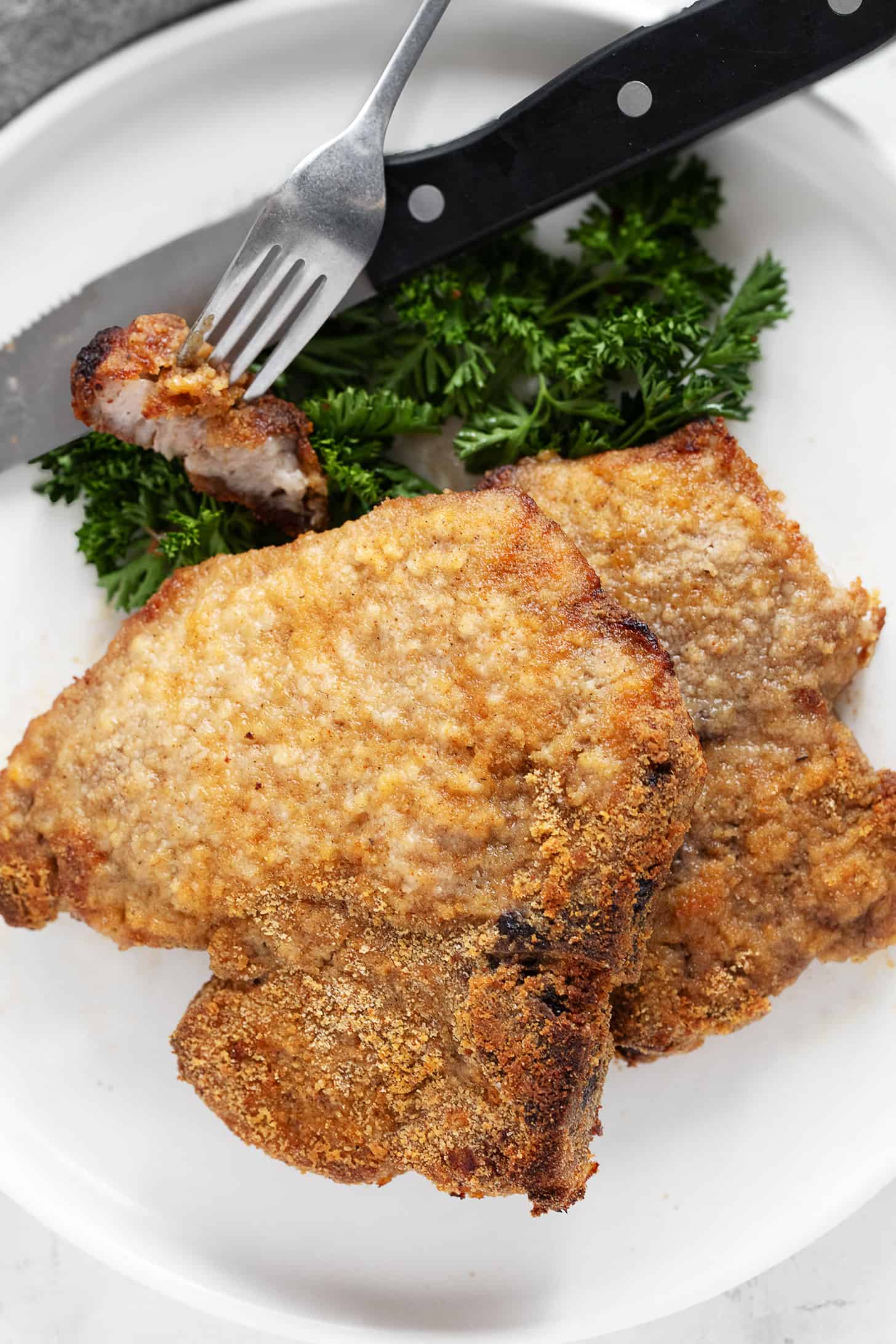 Homemade shake and bake pork chops plated.