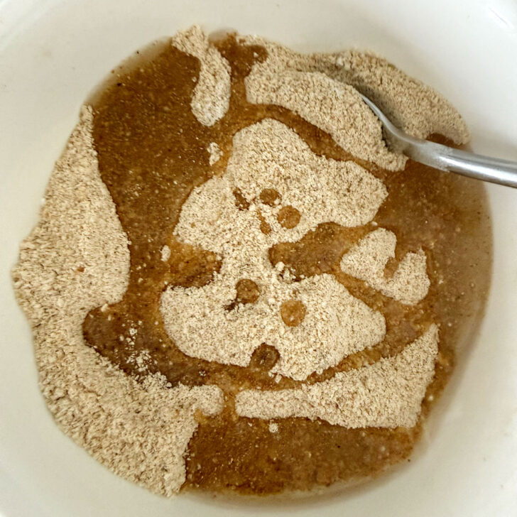 Oil drizzled into the bowl with the shake and bake ingredients.