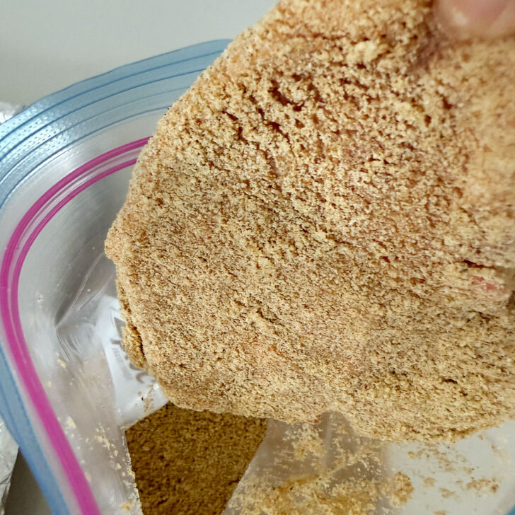 Pork chop after coating with the homemade shake and bake.