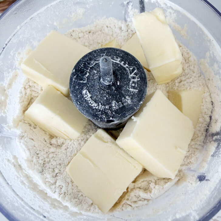 Cold butter cubes added to the food processor.