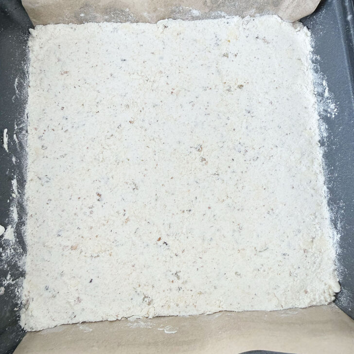 Base pressed into a baking pan.