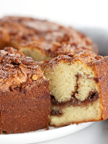 Tube-pan coffee cake sliced on a serving platter.