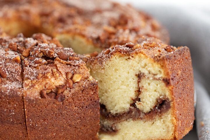Tube-pan coffee cake sliced on a serving platter.