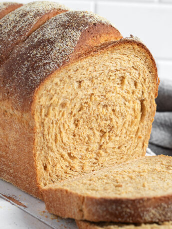Anadama Bread sliced on a cutting board.