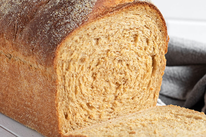 Anadama Bread sliced on a cutting board.
