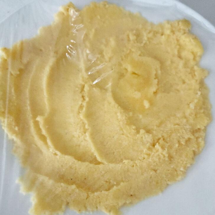 Cornmeal mash covered on a plate to cool.