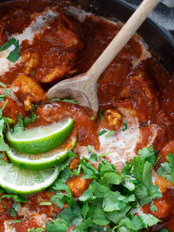 Chicken Tikka Masala in a skillet with a spoon.