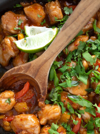 Mango chicken stir fry in a skillet.