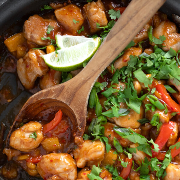 Mango chicken stir fry in a skillet.