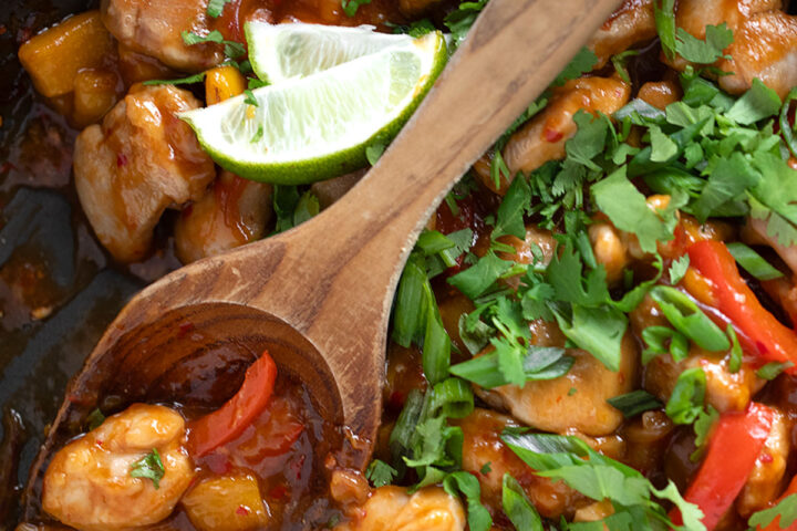 Mango chicken stir fry in a skillet.