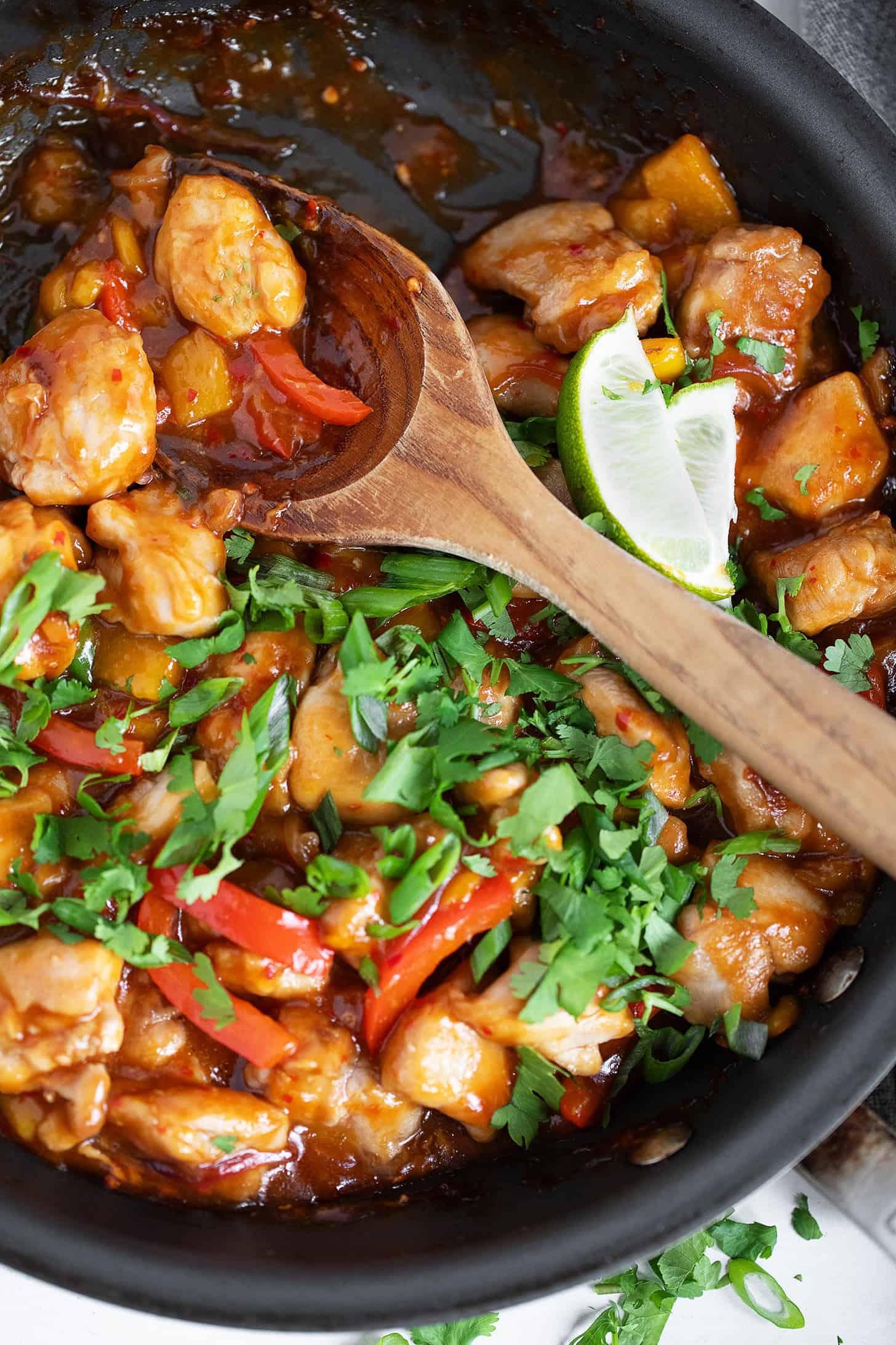 Mango chicken stir fry in a skillet.