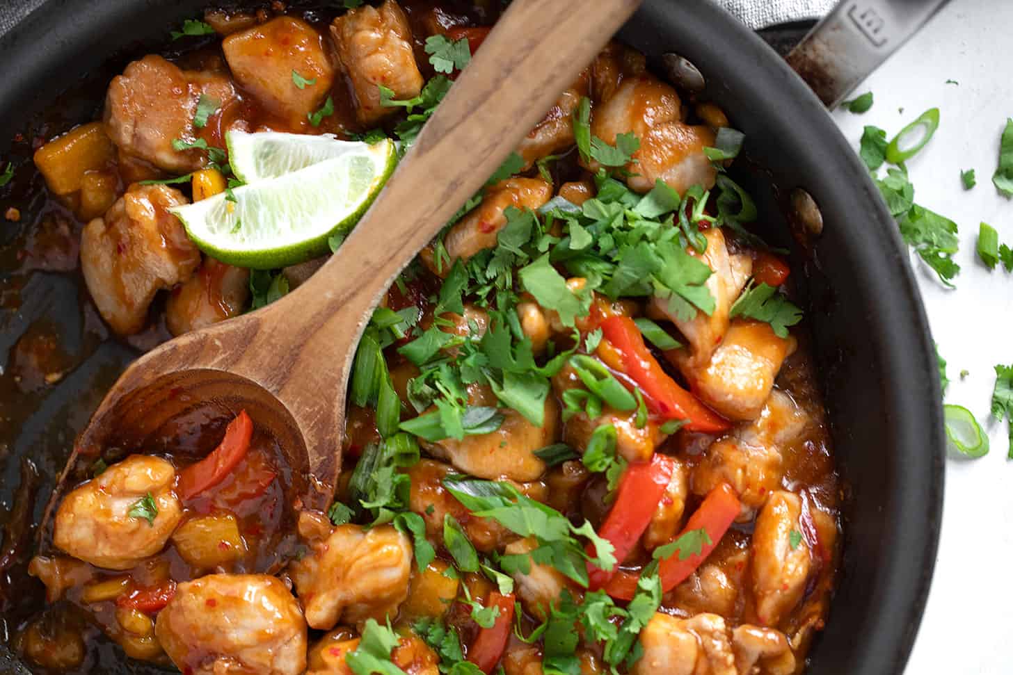 Mango chicken stir fry in a skillet.