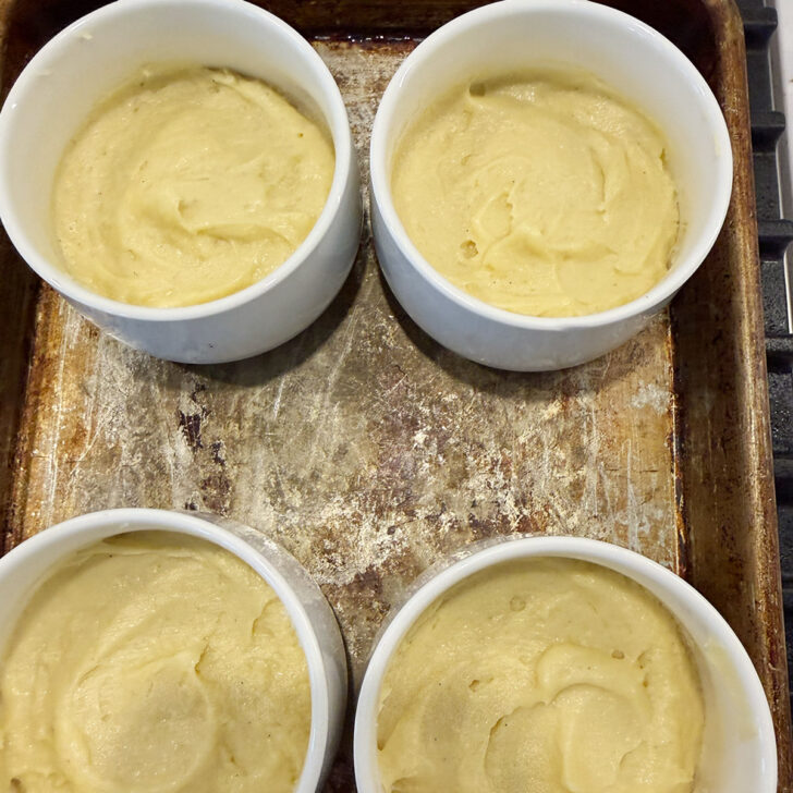 Cake batter divided between 4 ramekins.