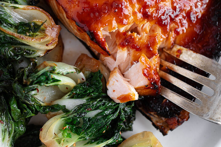 Hot honey salmon plated with bok choy.
