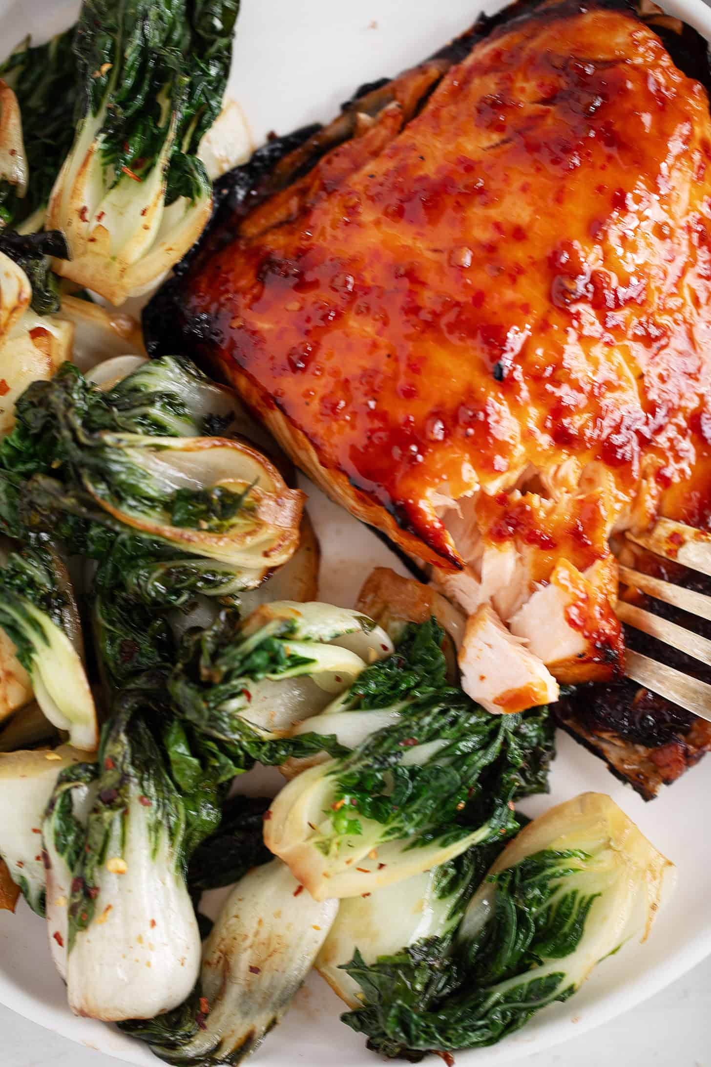 Hot honey salmon plated with bok choy.