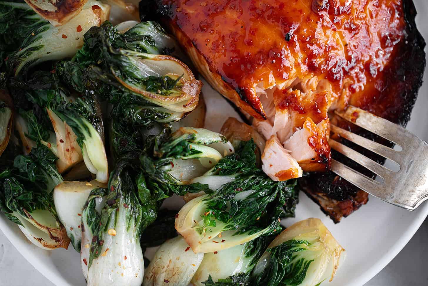Hot honey salmon plated with bok choy.
