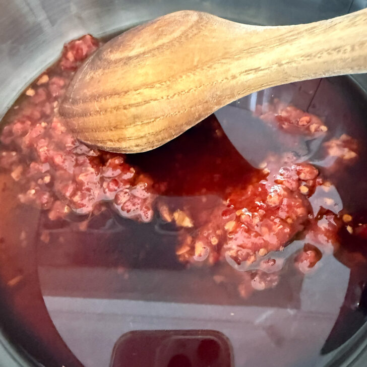 Hot honey salmon glaze ingredients in a saucepan.
