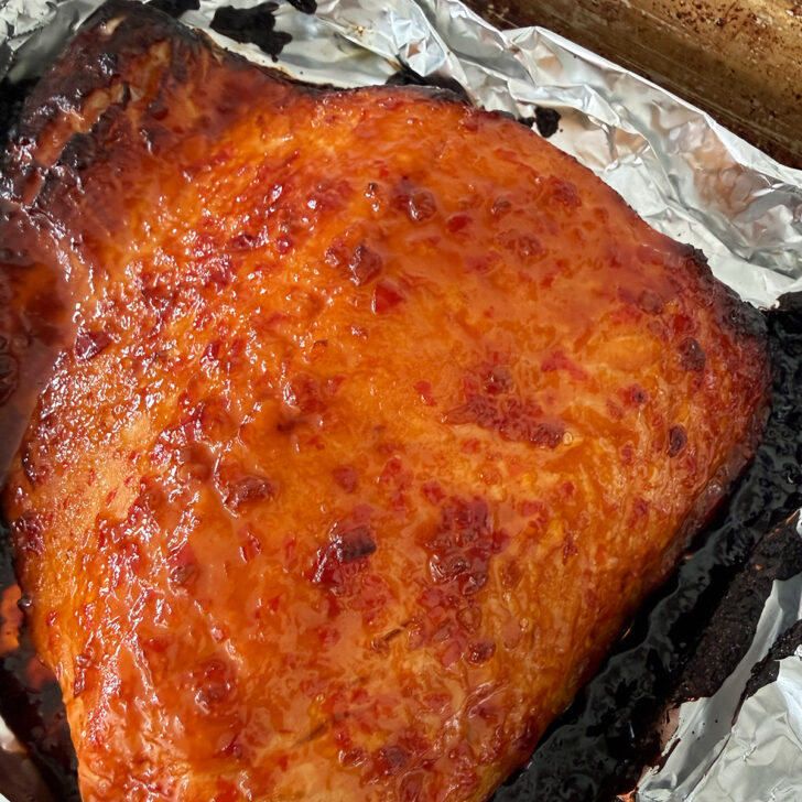 Finished hot honey salmon on the baking sheet.