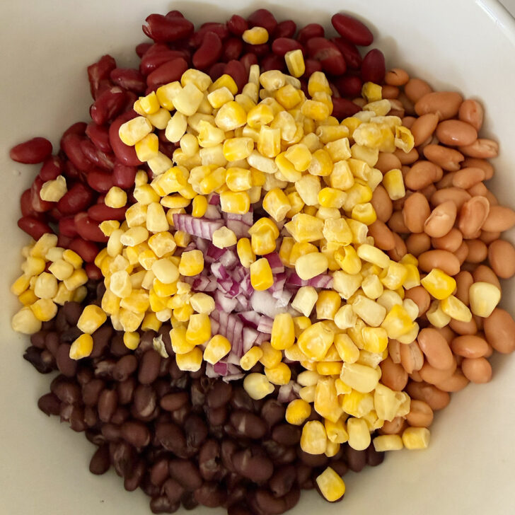 Rinsed beans and corn in a large bowl.