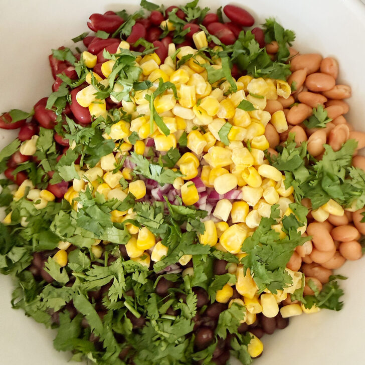 Cilantro added to the salad bowl.