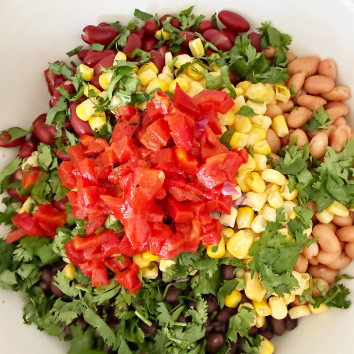 Roasted red peppers added to the salad bowl.