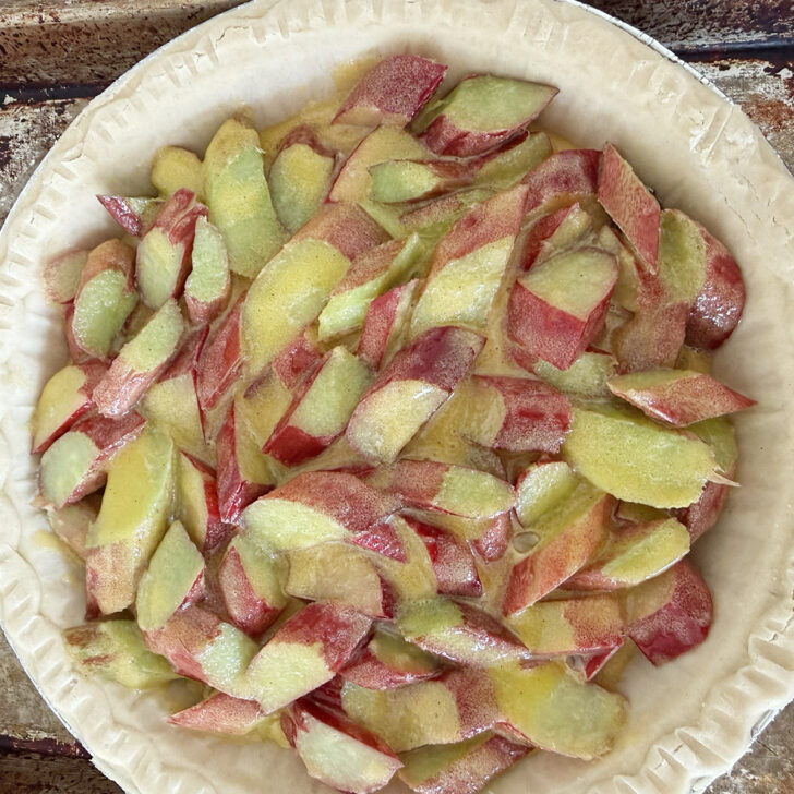 Rhubarb filling added to an unbaked pie shell.