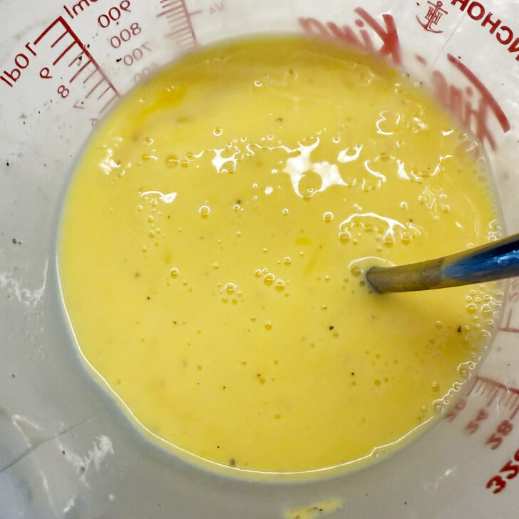 Egg and milk mixture after beating together.