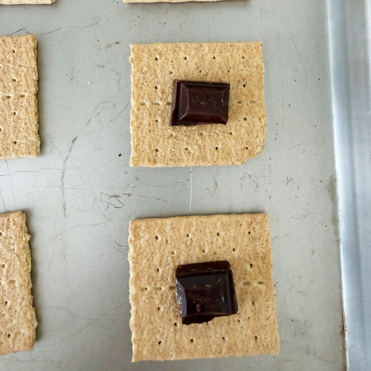 A square of chocolate placed on the graham cracker square.
