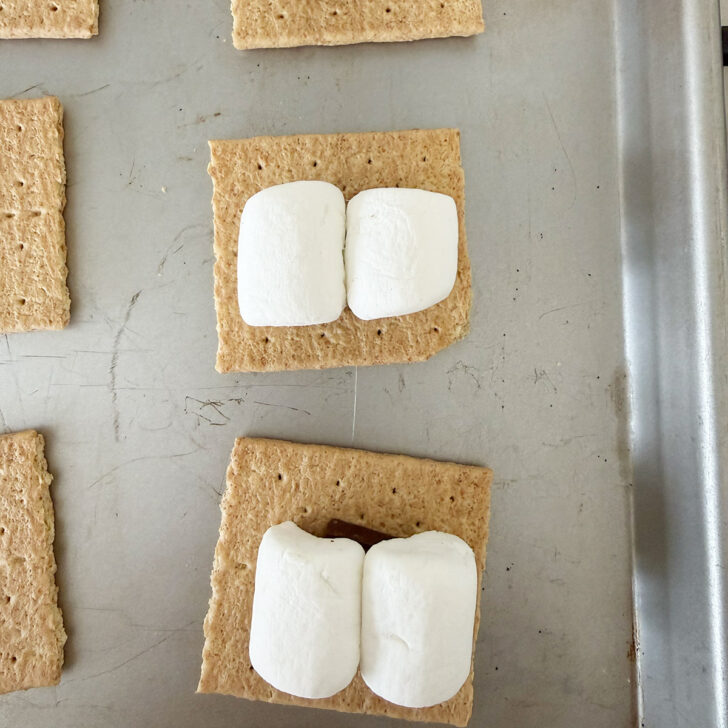 Marshmallow pieces placed on top of the chocolate square.