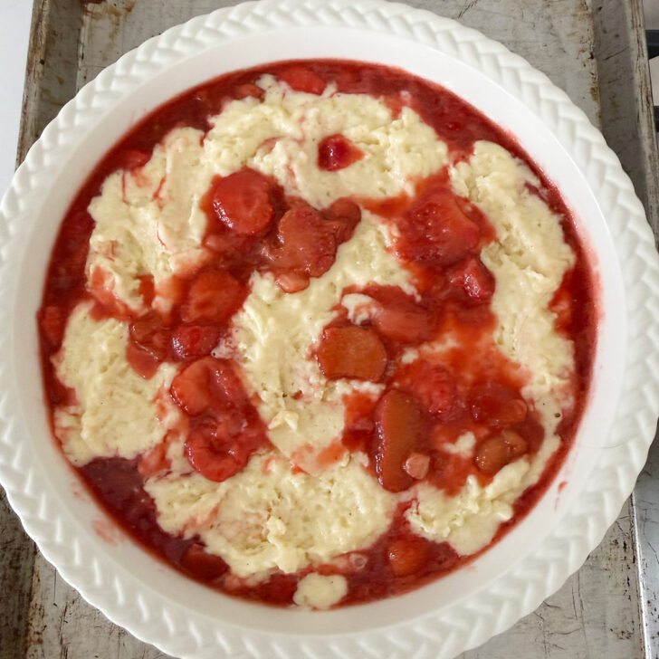 Assemble strawberry rhubarb pudding cake in the baking pan.