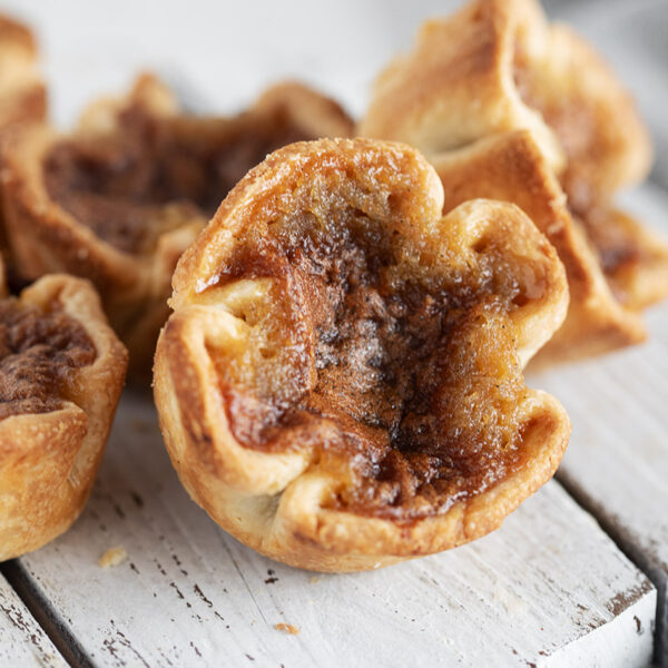 Classic Canadian butter tarts on a serving board.