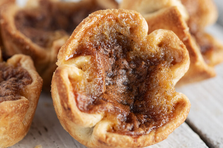 Classic Canadian butter tarts on a serving board.