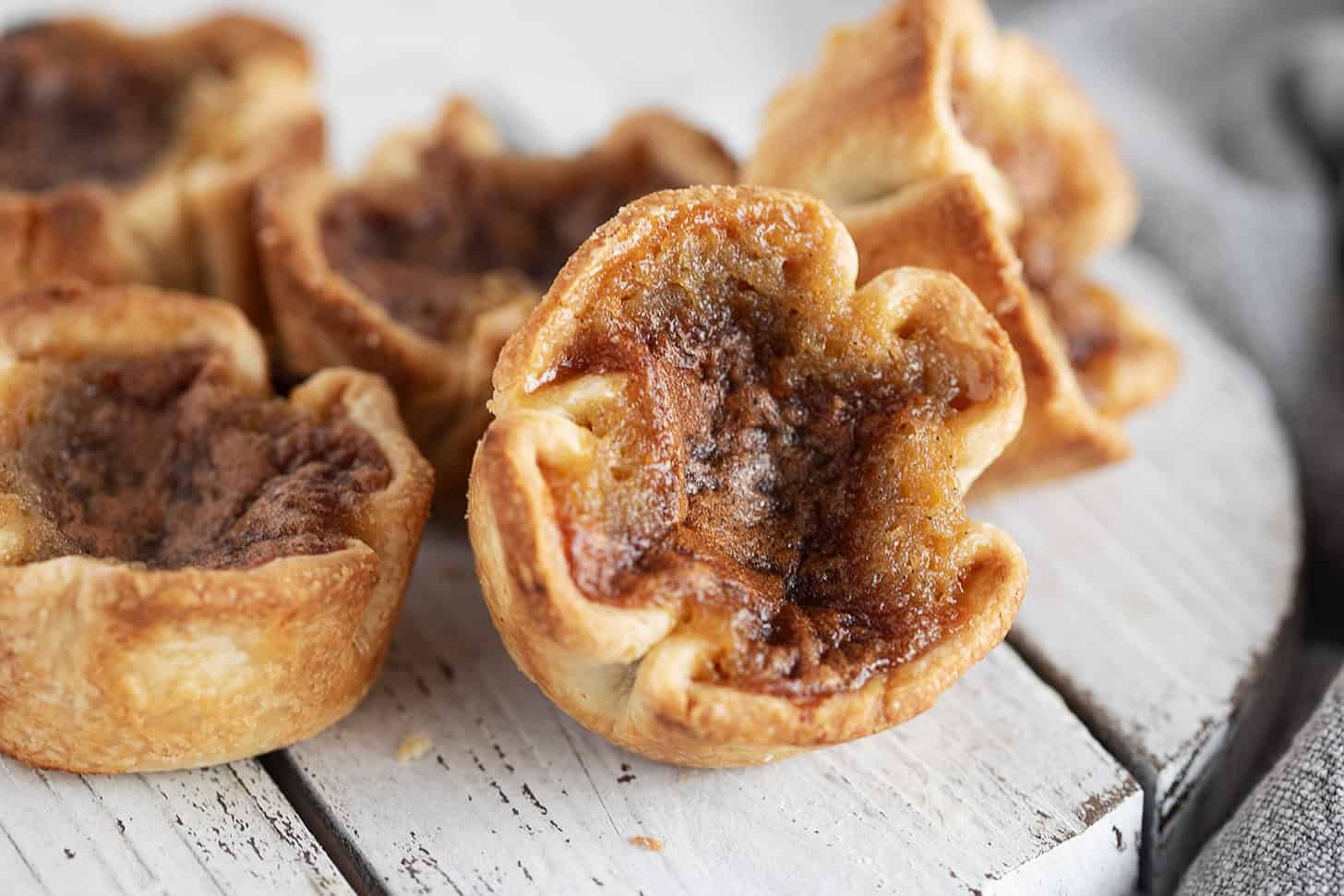 Classic Canadian butter tarts on a serving board.