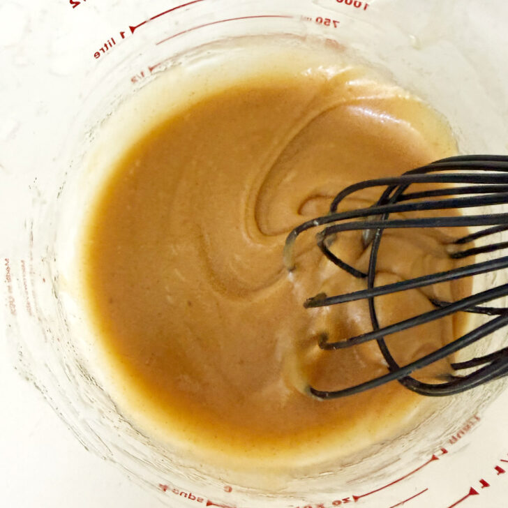Filling ingredients whisked together in a bowl.