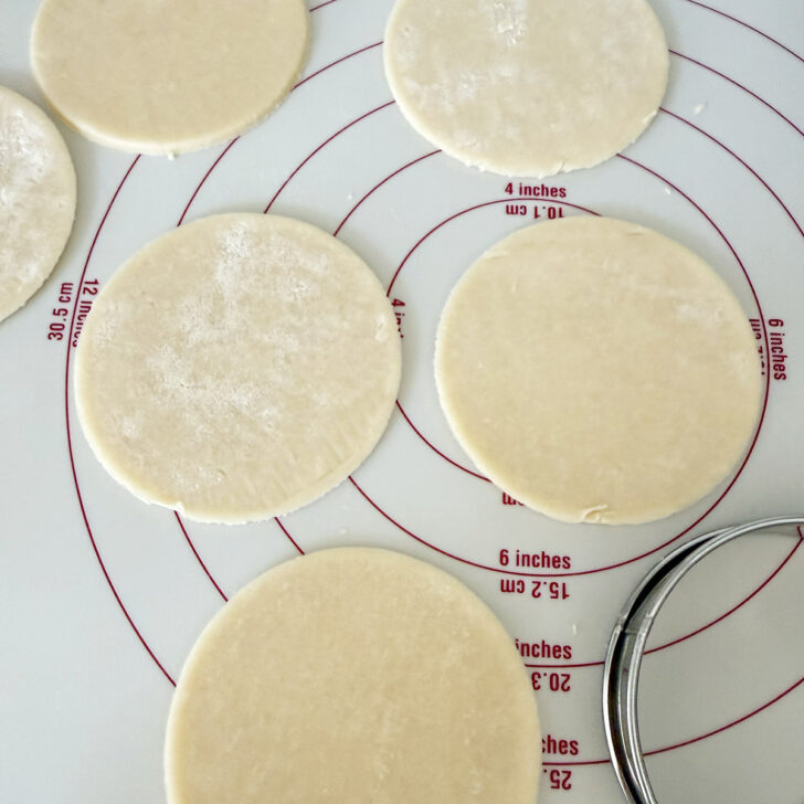 Rounds of pastry cut for the butter tarts.
