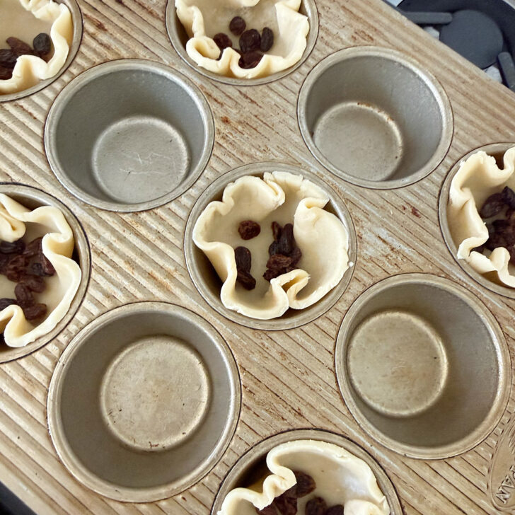 Raisins added to the muffin cups.
