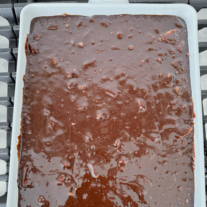 Brownie batter spread into a 9x13 inch pan.
