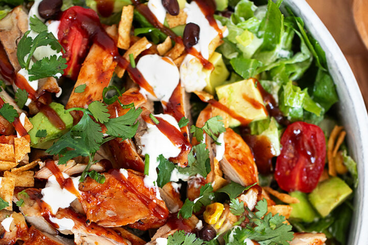 BBQ chicken dinner salad in a serving bowl.