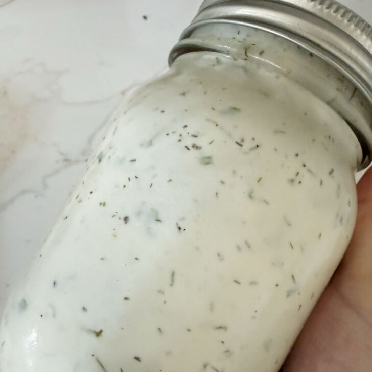 Buttermilk dressing in a jar after shaking together.