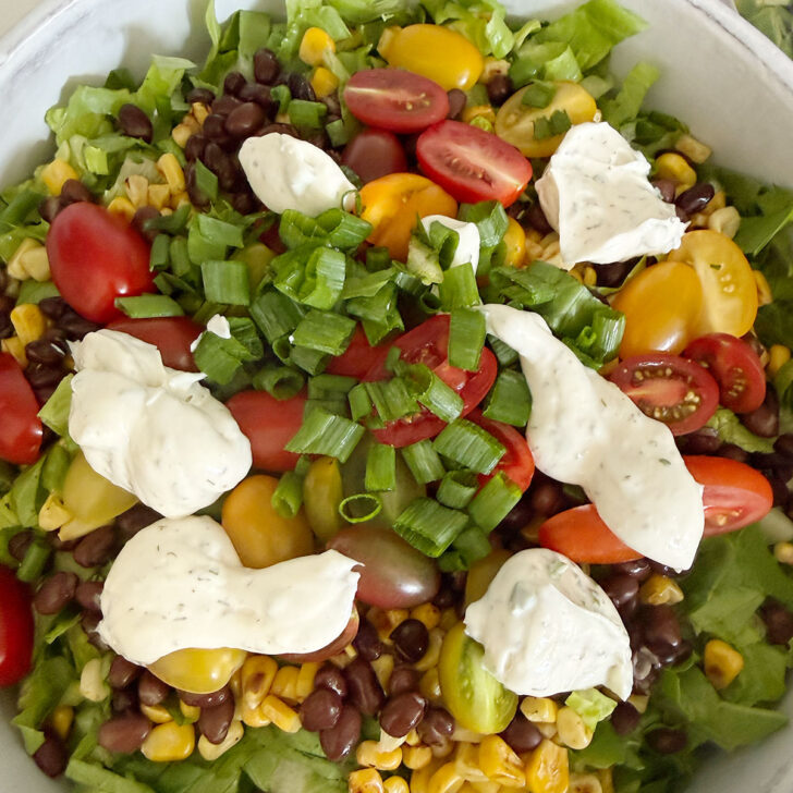 Dollops of the buttermilk herb dressing on top of the salad.