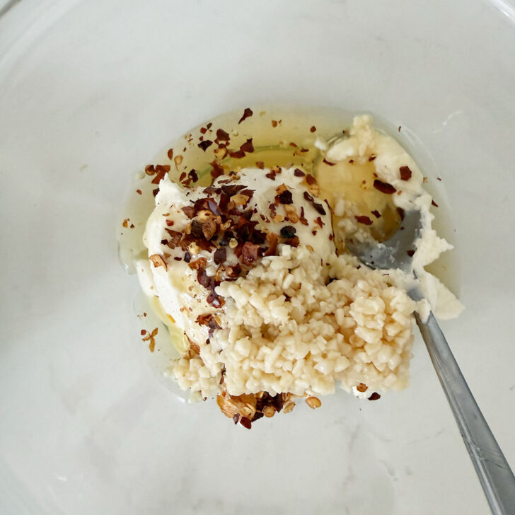 Mascarpone and honey spread ingredients in a bowl.