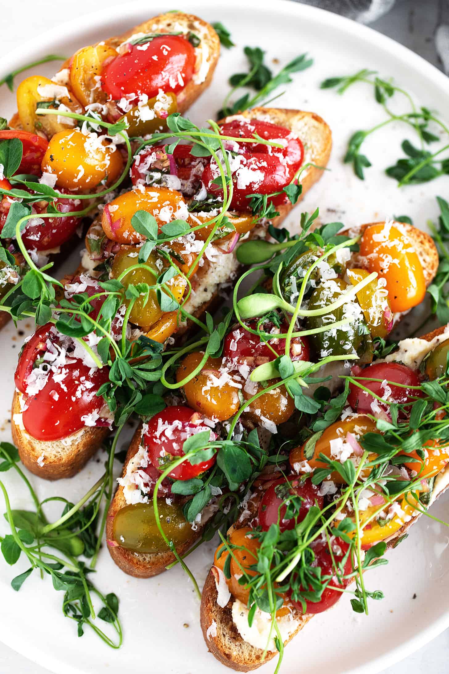 Cherry tomato bruschetta on a serving platter.