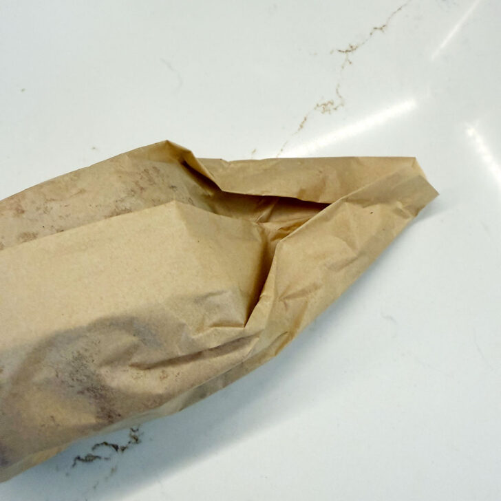 fold the ends of the parchment like wrapping a present.