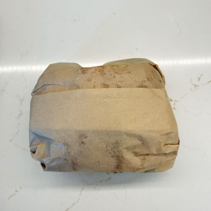 Folded ends tucked under the sandwiches.