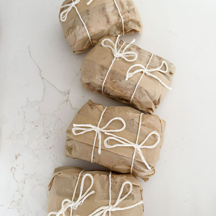 All four sandwiches double wrapped with string.