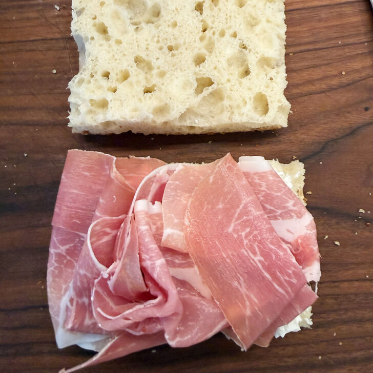 Prosciutto added to the focaccia sandwich.