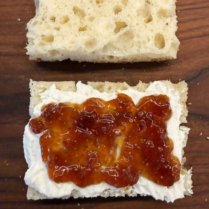 Whipped ricotta and fig jam spread onto the sliced focaccia.